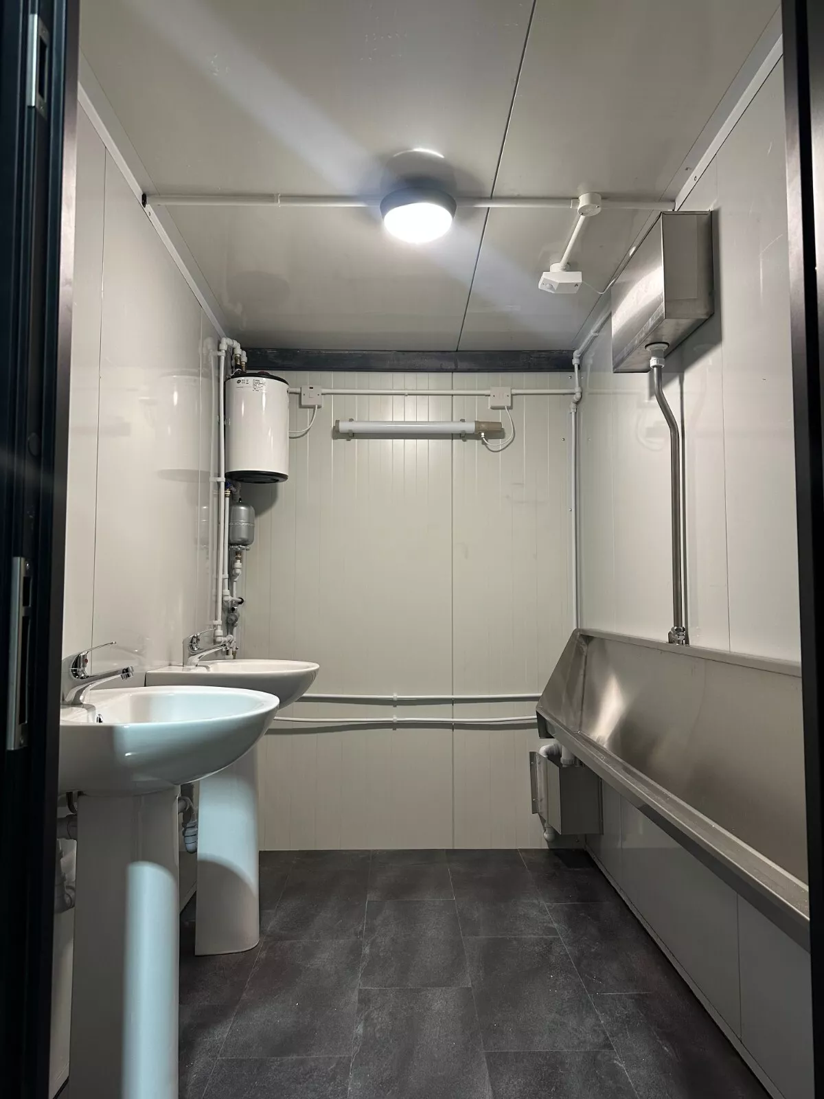 Triple toilet unit shipping container with three private restroom compartments